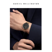 Daniel Wellington Petite Melrose Black Dial Rose Gold Mesh Strap Watch For Women - DW00100303