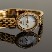 Tory Burch Oval Mother of Pearl Dial Gold Steel Strap Watch for Women - TBW6034